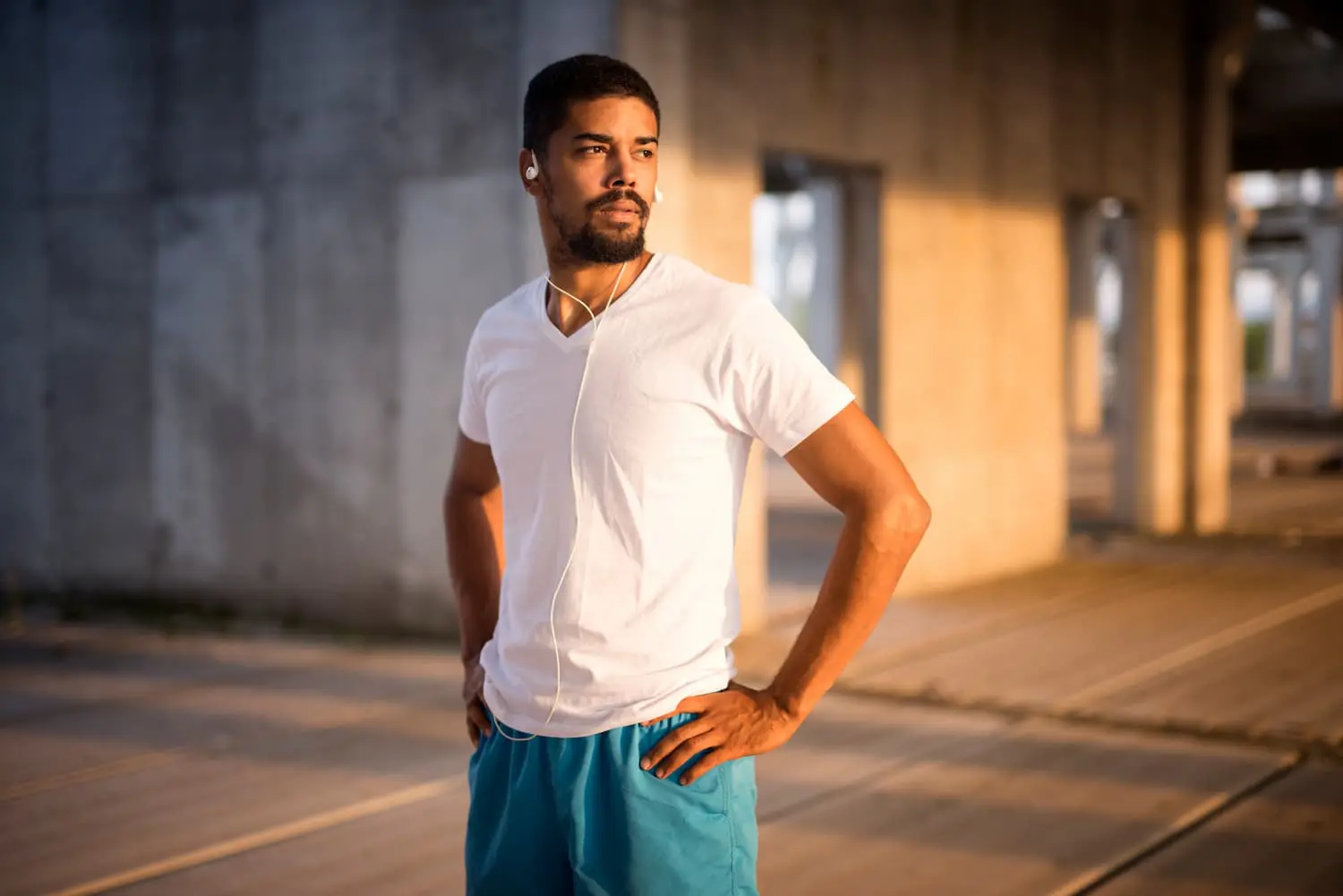 portrait-sporty-fit-athlete-with-earphones-getting-concentrated-training (1)